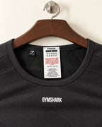 Gymshark cropped training top neck label showing size S